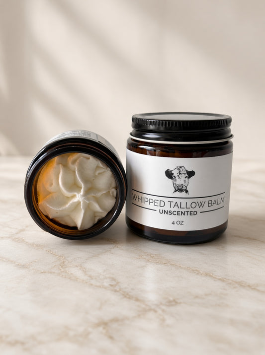 Open jar of unscented whipped tallow balm showing the whipped texture, next to a 4 oz jar