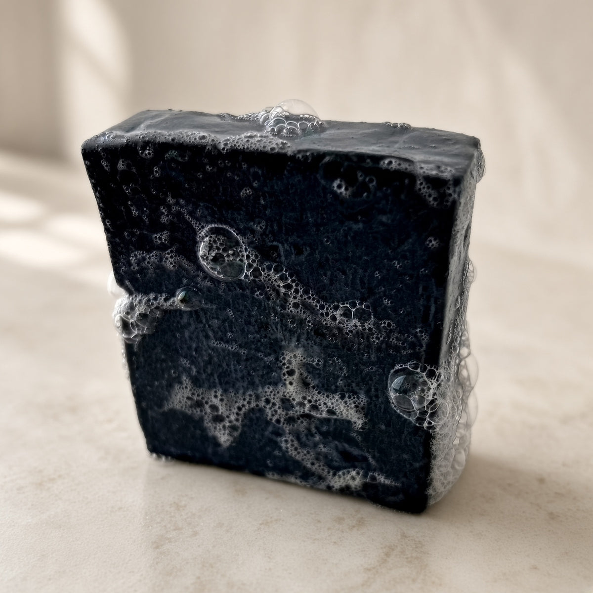 Lathered Tallow + Charcoal Cleansing Bar, grass-fed tallow soap with bubbles